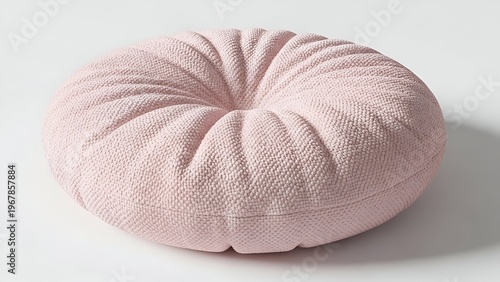 A round pink cushion with subtle texture symbolizes emotional softness.