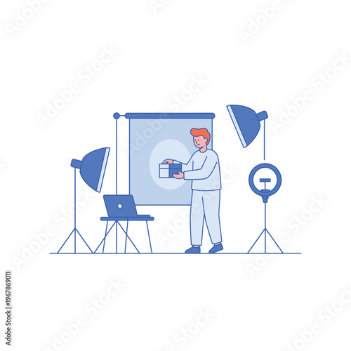 Man holding product for photoshoot with studio lighting.