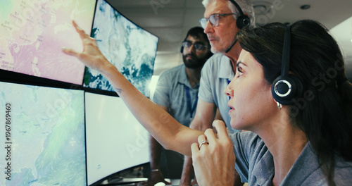 Obraz na płótnie Computer screen, meteorology and team with people in control room for storm, research and monitor