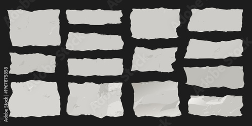 Collection of torn paper scraps against a dark black background