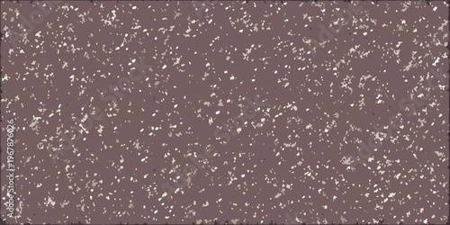 Close up of a textured mottled surface with a pinkish brown tone