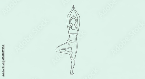 Woman performing yoga tree pose vrksasana with arms raised in air on light green background