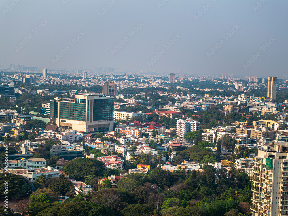 Fototapeta premium Aerial view of the modern high-rise skyscrapers in Bengaluru, Karnataka, showcasing the city's dynamic skyline. Cityscape highlights Bengaluru's blend of urban development and architectural brilliance