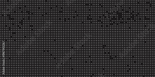 A dense textured pattern of small uniform dots in black and white