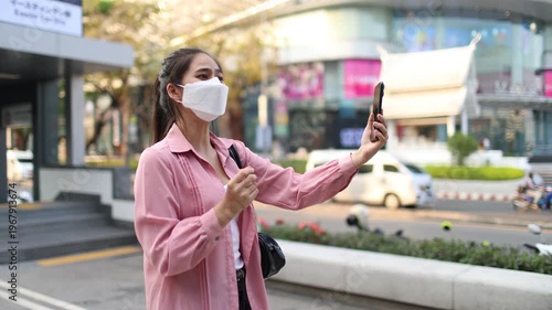 Person wearing mask in toxic urban air, monitoring pollution levels on device, highlighting health risks, environmental hazards, smog, and city pollution concerns.
