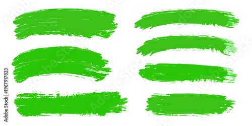Collection of vibrant green brush strokes arranged on a white background