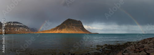 Panoramic view of Kirkjufell mountain with rainbow 2025