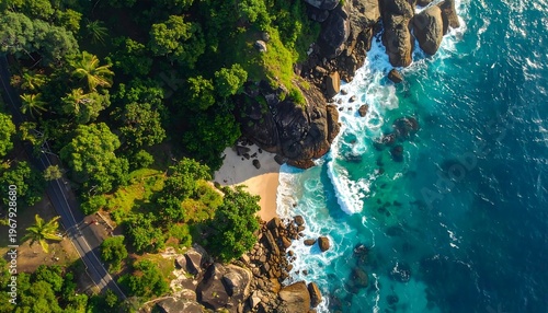 Aerial view of a rocky coastline with lush greenery and ocean waves