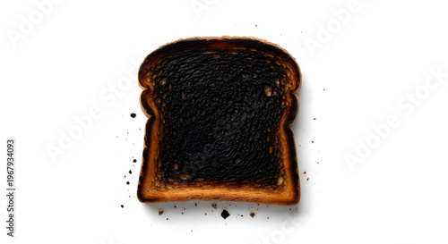 Burnt toast on white background closeup.