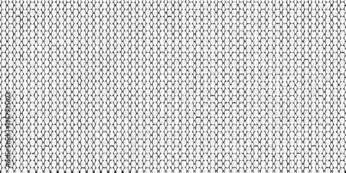 Close up of a tightly woven textured fabric with a repetitive pattern