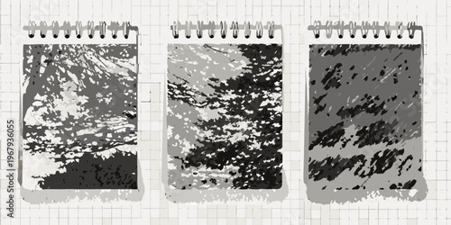 Three spiral notebooks with abstract textured gray and black pages