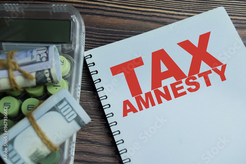 Принти на полотні Concept of tax amnesty write on book isolated on Wooden Table