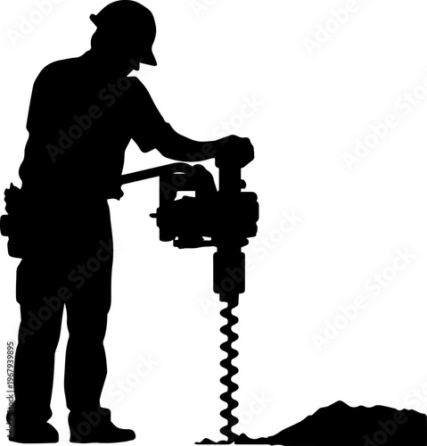 Silhouette of a construction worker using a power auger to drill a hole in the ground