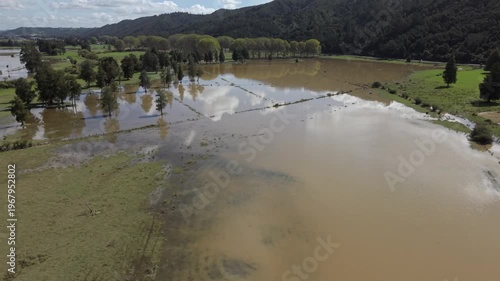 Aerial flooded farmland after heavy rain Northland New Zealand rural landscape disaster
