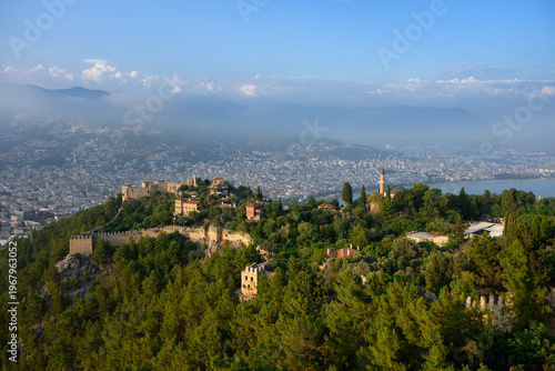 Fotografija Alanya Castle Panorama with Ancient Walls and Mosque Minaret, Historical Fortress in Turkey, Mediterranean Sea Coastline, Morning Mist over City and Mountains