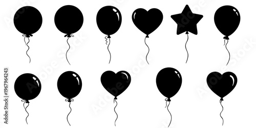 Black balloons and heart shapes float in the air with ribbons