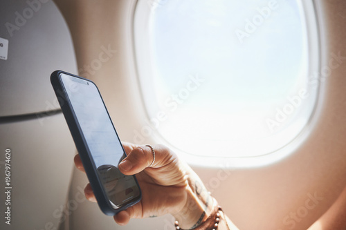 Fotografie Hands, phone screen and person in plane for travel, boarding pass or check flight details