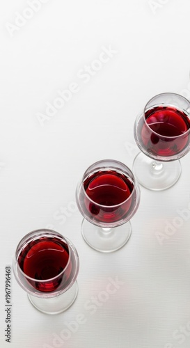 Three Glasses of Red Wine Isolated.