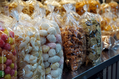 Variety of Traditional Korean Puffed Rice Snacks (Pungtwigi) in Plastic Bags