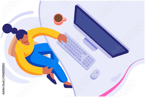 Woman sits at desk using computer with keyboard and monitor nearby