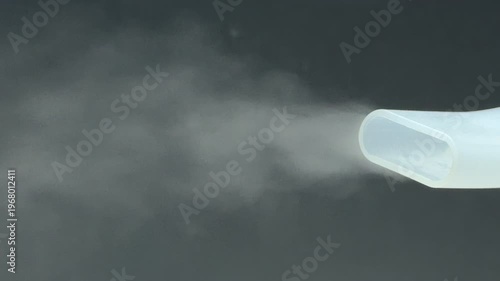 Wallpaper Mural A medical nebulizer nozzle sprays a fine, soothing vapor against a dark background. The steady flow of mist creates a sense of relief and calm. This vital tool helps with easy breathing. Torontodigital.ca