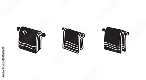 Set of three rolled towels on a rod  bathroom accessories  home essentials  towels on a holder