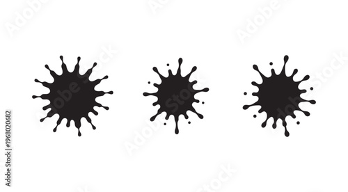 Three black ink splatters on white background  no text  simple design elements