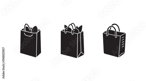 Three black shopping bags with handles on white background  retail shopping icons