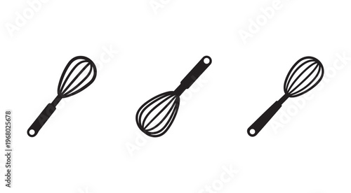 Three black wire whisks with handles on white background for cooking and baking  kitchen utensils