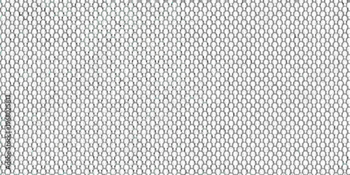 Close up of a perforated metal sheet with a repeating circular pattern