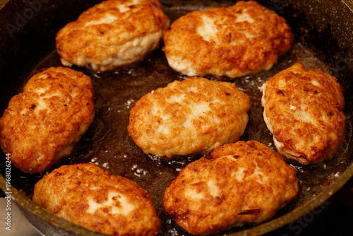 Картината върху платно Minced meat cutlets are fried in oil in a frying pan