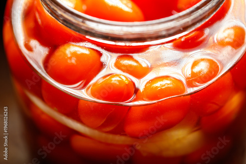 A jar of red tomatoes
