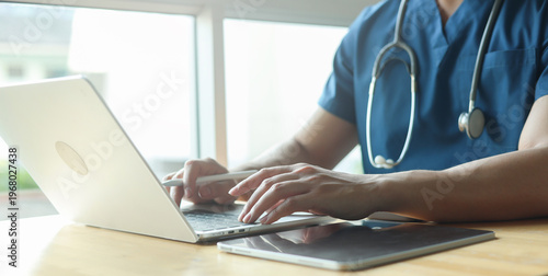 Konstfotografi Close up specialist doctor use laptop to check about patient’s opd and read or r