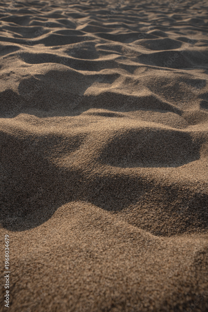 Fototapeta premium Natural abstract texture background with minimal composition and flowing organic patterns. Close up of wind formed sand ripples.