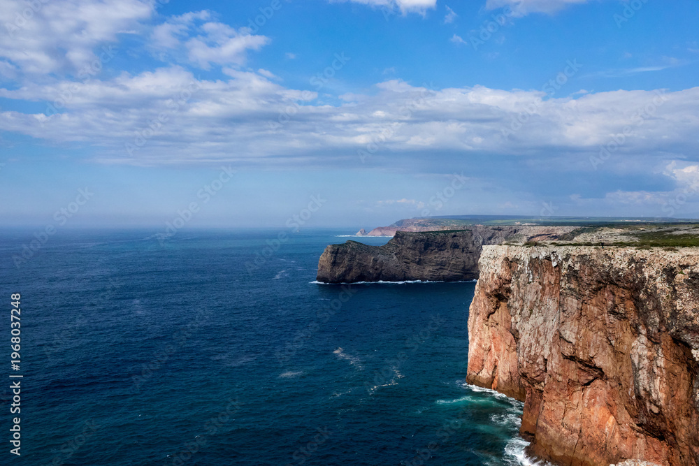 Fototapeta premium Turquoise Ocean Waves Along Dramatic Algarve Coastline in Portugal