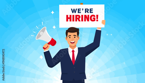 Smiling businessman holding a We're Hiring sign and megaphone.