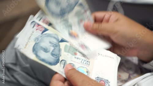 Banknote counting Singapore dollars SGD, Singapore money for payment