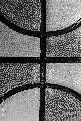 Monochrome close-up of a basketball's textured surface