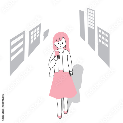 スマートフォンを見ながら道を歩く若いビジネスパーソンの女性