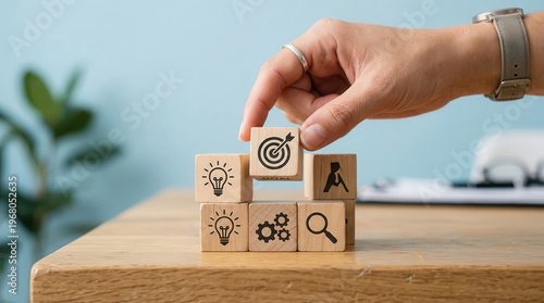 Business Strategy Planning with Wooden Blocks and Target Icon