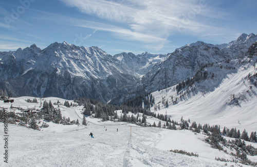 European Alps at skiing area Brandnertal, snowy mountains with blue sky