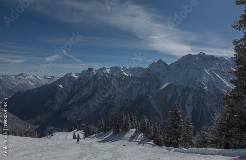 European Alps at skiing area Brandnertal, snowy mountains with blue sky