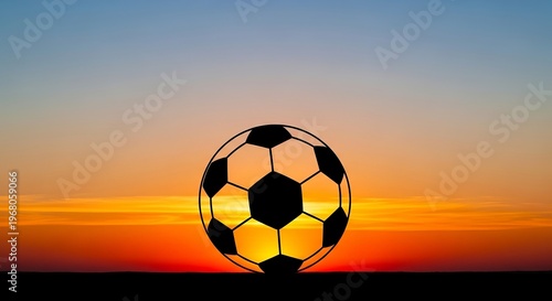 Soccer ball silhouette, sunset background, sports photography, football icon