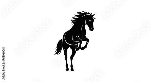 Silhouette of a powerful horse rearing up with flowing mane and tail