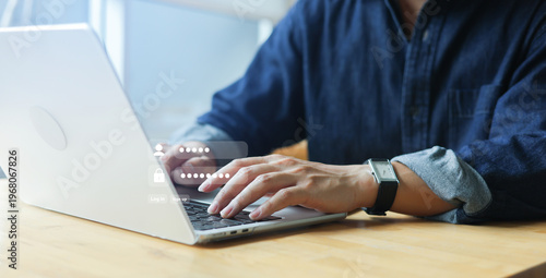 close up man hand type on laptop to access account on website by input username and password at office for security system of business technology concept