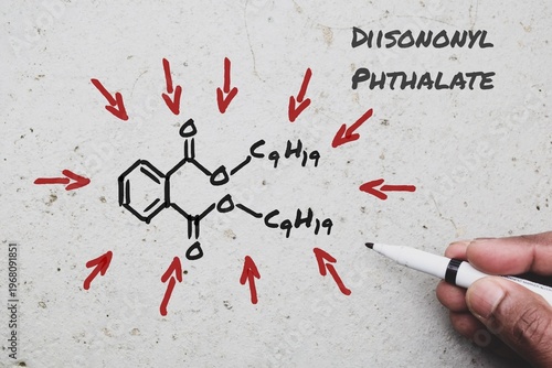 Chemical structure of Diisononyl Phthalate DINP on the wall background. DiNP known for flexibility and durability used as a plasticizer to make PVC, inflatable toys, food packaging etc. 