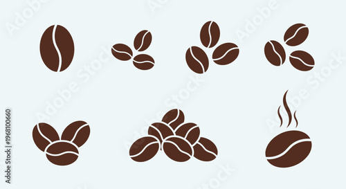 Different Arrangements of Roasted Coffee Beans with Steam on a Light Blue Background