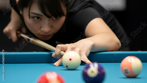 Woman playing billiards aiming at cue ball on pool table with focus