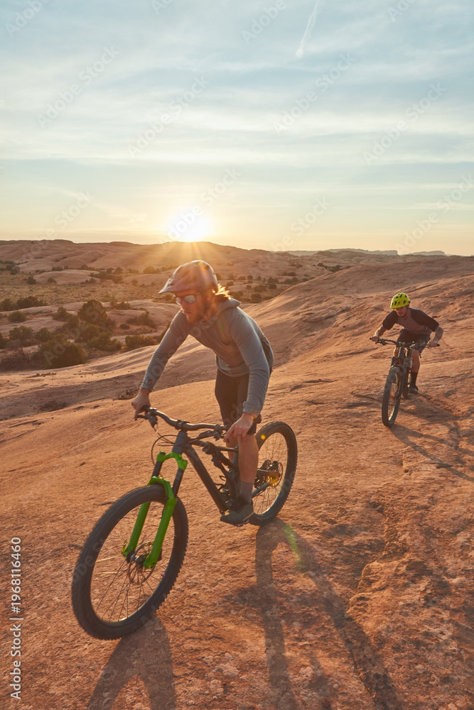 Fototapeta premium Mountain biking, ride and fitness with men in nature for race, extreme sports and adventure. Sky space, training and journey with people or friends on bicycle outdoor cycling, exercise and flare