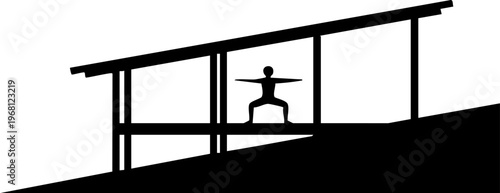 Silhouette person practicing yoga inside modern architectural building with large windows and slanted roof line.